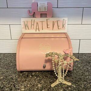 Pink bread, box, whatever sign, elephant calendar, pink dove